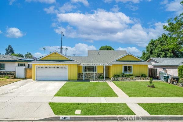 1426 E Colver Pl, Covina, CA 91724 - single story home with a garage, board and batten siding, and driveway