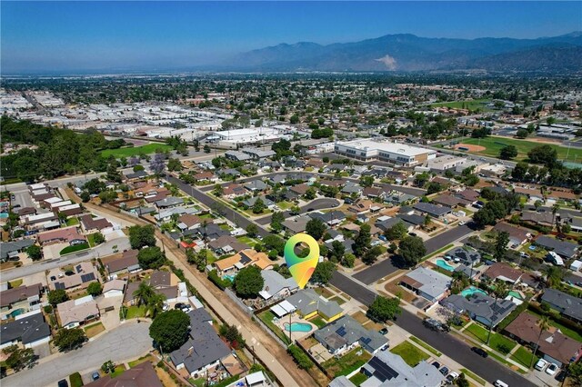 1426 E Colver Pl, Covina, CA 91724 - aerial view of property and surrounding area featuring a mountain backdrop and nearby suburban area