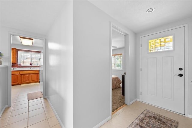 1426 E Colver Pl, Covina, CA 91724 - foyer with light tile patterned floors and baseboards