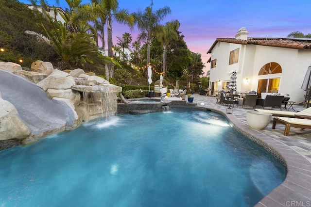 4520 Tarantella Ln, San Diego, CA 92130 - pool at dusk with a patio area and a pool with connected hot tub