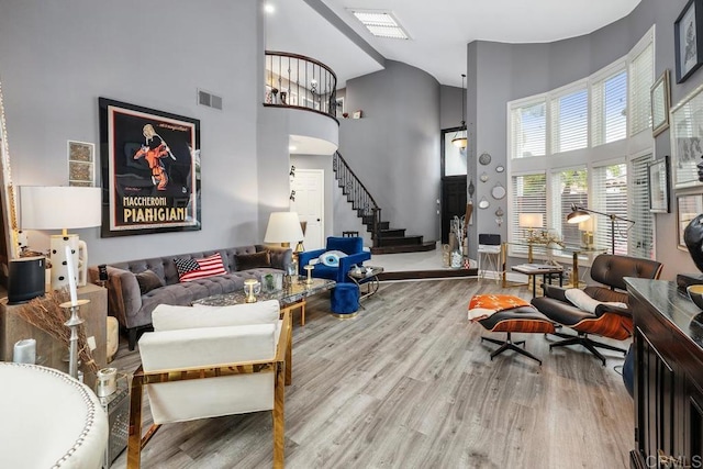 4520 Tarantella Ln, San Diego, CA 92130 - living room with stairs, high vaulted ceiling, wood finished floors, and baseboards