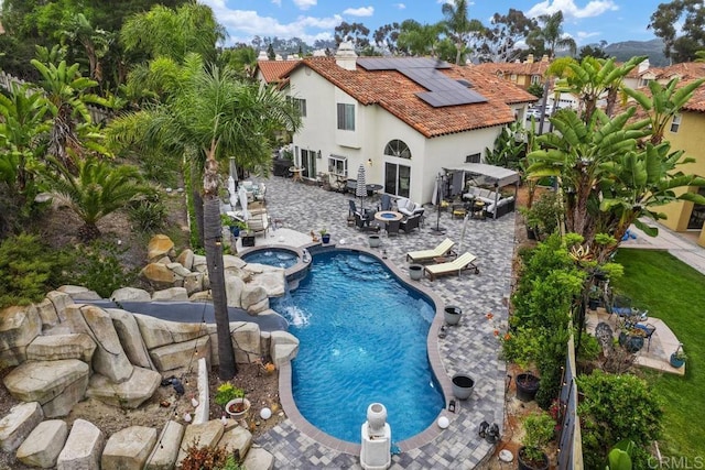 4520 Tarantella Ln, San Diego, CA 92130 - view of swimming pool featuring a gazebo, outdoor dining space, a patio area, a pool with connected hot tub, and a fenced backyard