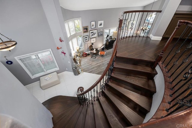 4520 Tarantella Ln, San Diego, CA 92130 - stairs with wood finished floors and vaulted ceiling