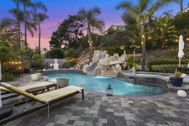 4520 Tarantella Ln, San Diego, CA 92130 - pool at dusk featuring a patio and a pool with connected hot tub