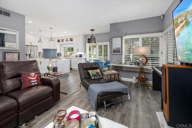 4520 Tarantella Ln, San Diego, CA 92130 - living area featuring light wood-type flooring, baseboards, and recessed lighting