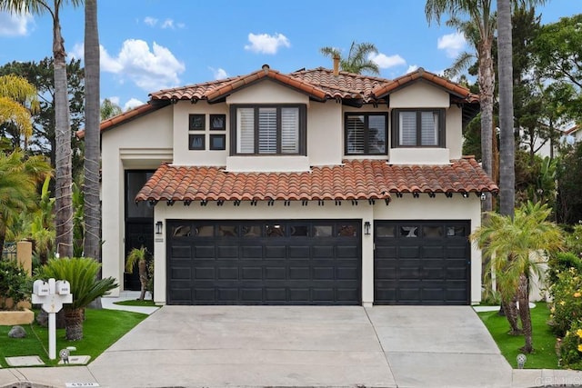 4520 Tarantella Ln, San Diego, CA 92130 - mediterranean / spanish home featuring driveway, a tiled roof, a garage, and stucco siding
