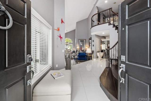 4520 Tarantella Ln, San Diego, CA 92130 - tiled foyer featuring stairs and high vaulted ceiling