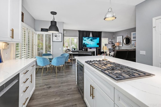 4520 Tarantella Ln, San Diego, CA 92130 - kitchen with appliances with stainless steel finishes, white cabinetry, and hanging light fixtures