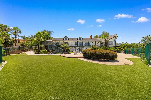 2360 Oakleaf Canyon Rd, Walnut, CA 91789 - rear view of house with stairway, a patio, and a chimney