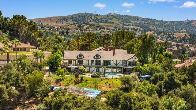 2360 Oakleaf Canyon Rd, Walnut, CA 91789 - view of subject property with a mountain backdrop and a pool area