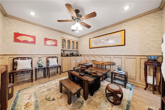 2360 Oakleaf Canyon Rd, Walnut, CA 91789 - living room featuring crown molding, ceiling fan, light wood-style floors, a wainscoted wall, and a decorative wall