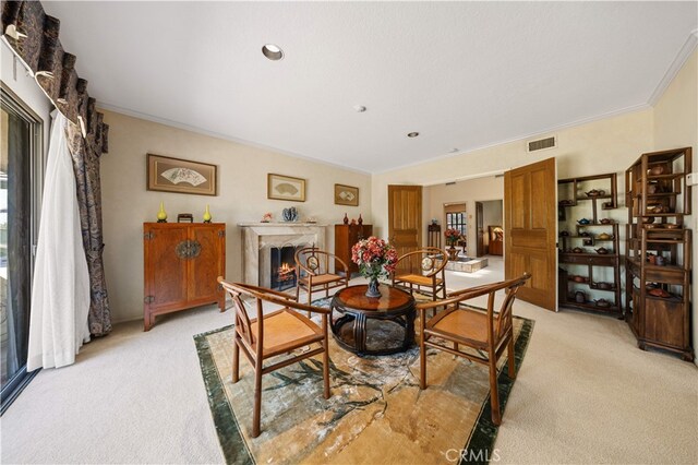 2360 Oakleaf Canyon Rd, Walnut, CA 91789 - dining space featuring light carpet, healthy amount of natural light, crown molding, and a lit fireplace