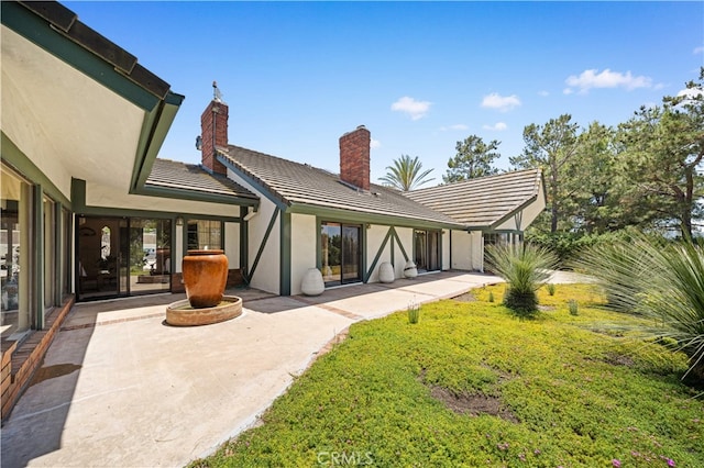 2360 Oakleaf Canyon Rd, Walnut, CA 91789 - rear view of house with a patio area, a chimney, stucco siding, and a tiled roof