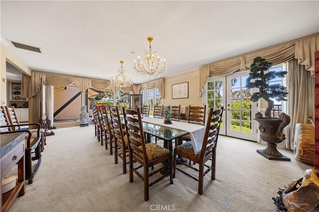 2360 Oakleaf Canyon Rd, Walnut, CA 91789 - carpeted dining space with a chandelier, a textured ceiling, and french doors