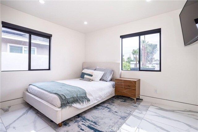 22940 Sherman Way, West Hills, CA 91307 - bedroom featuring marble look tile flooring, recessed lighting, multiple windows, and baseboards