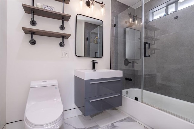 22940 Sherman Way, West Hills, CA 91307 - bathroom featuring toilet, vanity, marble finish floors, and bath / shower combo with glass door