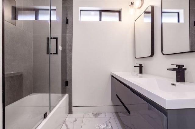 22940 Sherman Way, West Hills, CA 91307 - full bathroom featuring marble finish flooring, plenty of natural light, double vanity, and combined bath / shower with glass door
