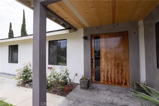 22940 Sherman Way, West Hills, CA 91307 - view of exterior entry with stucco siding and a patio area