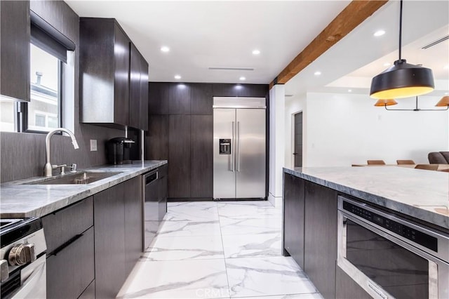 22940 Sherman Way, West Hills, CA 91307 - kitchen with stainless steel appliances, modern cabinets, light stone countertops, pendant lighting, and light marble finish floors