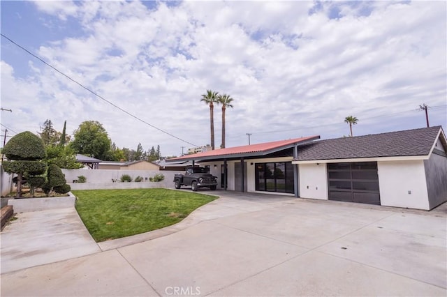 22940 Sherman Way, West Hills, CA 91307 - view of front of property featuring concrete driveway, a garage, and stucco siding