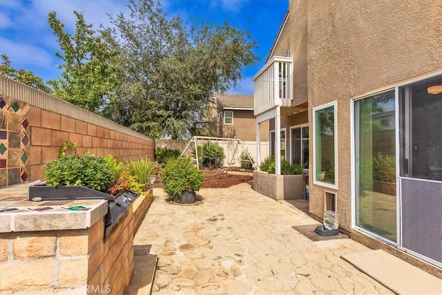 31488 Hallwood Ct, Menifee, CA 92584 - fenced backyard featuring a patio area and area for grilling