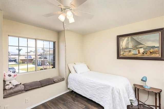 31488 Hallwood Ct, Menifee, CA 92584 - bedroom with dark wood-type flooring, baseboards, and ceiling fan