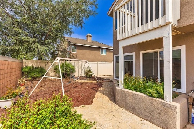 31488 Hallwood Ct, Menifee, CA 92584 - fenced backyard featuring a balcony