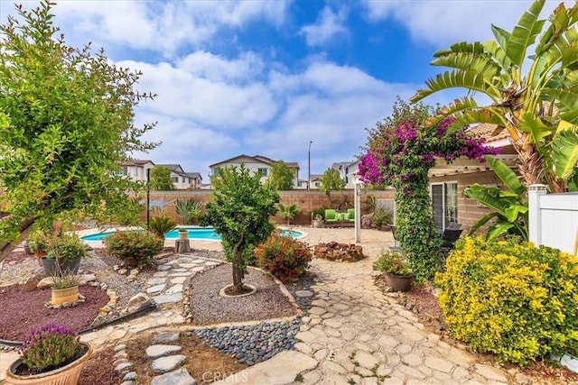 31488 Hallwood Ct, Menifee, CA 92584 - fenced backyard with a patio area and a residential view