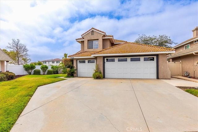31488 Hallwood Ct, Menifee, CA 92584 - view of front of home with stucco siding, driveway, a tiled roof, and a garage