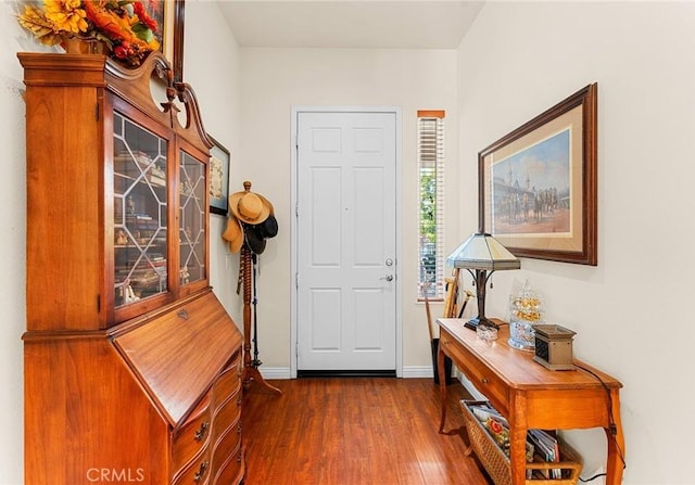 1574 Litchfield Ct, Banning, CA 92220 - foyer entrance with dark wood-style floors and baseboards