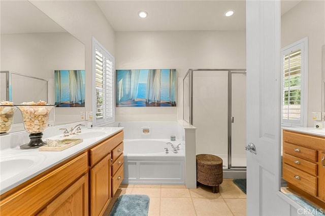 1574 Litchfield Ct, Banning, CA 92220 - full bathroom featuring a stall shower, a bath, double vanity, and healthy amount of natural light