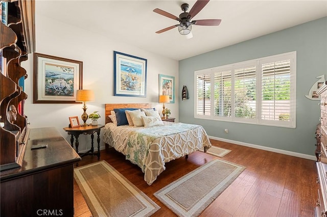 1574 Litchfield Ct, Banning, CA 92220 - bedroom with baseboards, dark wood finished floors, and ceiling fan