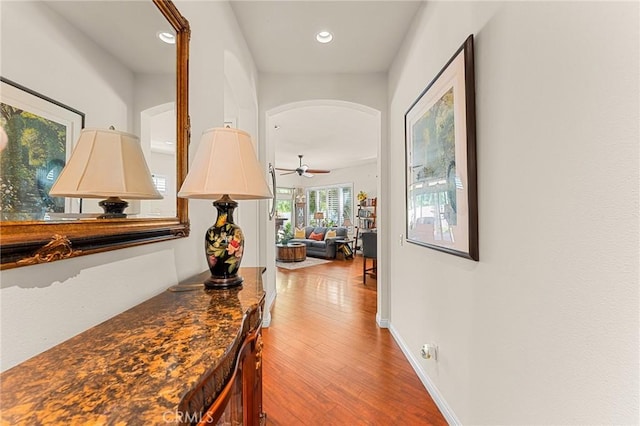 1574 Litchfield Ct, Banning, CA 92220 - hall with wood finished floors, recessed lighting, arched walkways, and baseboards