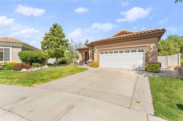 1574 Litchfield Ct, Banning, CA 92220 - mediterranean / spanish house with concrete driveway, stucco siding, a tiled roof, and a garage