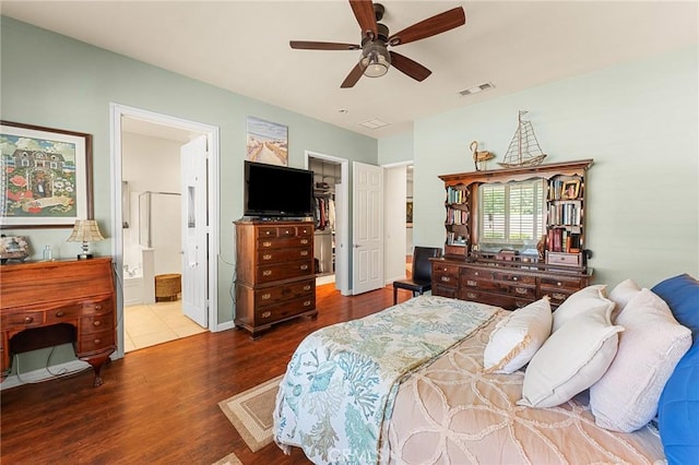 1574 Litchfield Ct, Banning, CA 92220 - bedroom featuring wood finished floors, a spacious closet, ensuite bathroom, and a ceiling fan