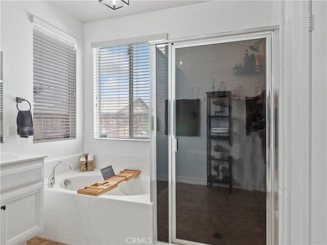 15631 Moccasin Ct, Victorville, CA 92394 - full bathroom featuring vanity, a bath, and a stall shower