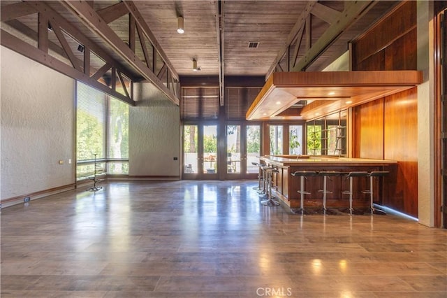 23615 Falcons View Dr, Diamond Bar, CA 91765 - indoor dry bar with a towering ceiling, a textured wall, wood finished floors, and wooden ceiling
