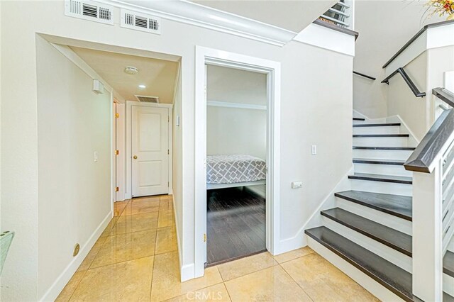 13184 Spire Cir, Chino Hills, CA 91709 - hallway featuring tile patterned flooring, baseboards, stairway, recessed lighting, and crown molding
