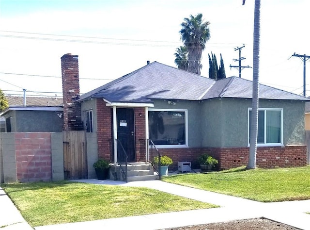 2212 N Locust Ave, Compton, CA 90221 - single story home with brick siding, stucco siding, and roof with shingles