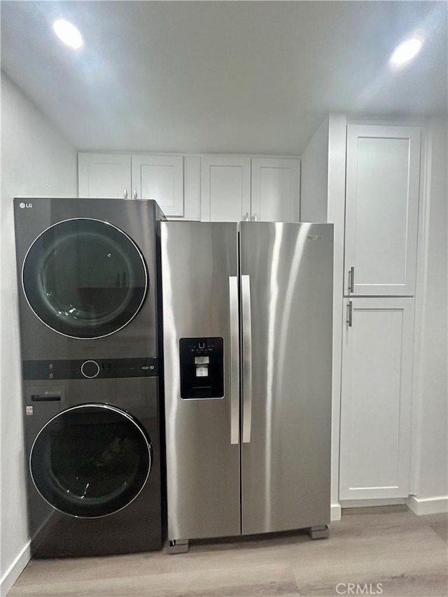 333 Burchett St Unit 203, Glendale, CA 91203 - laundry room with stacked washer / drying machine and light wood-style floors