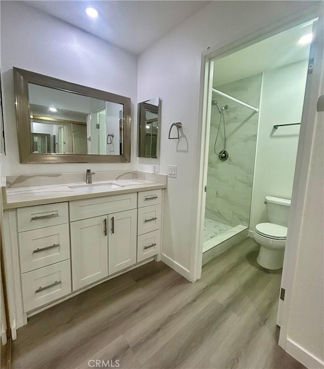 333 Burchett St Unit 203, Glendale, CA 91203 - full bath featuring a marble finish shower, wood finished floors, and vanity