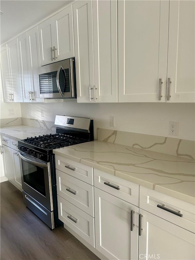 333 Burchett St Unit 203, Glendale, CA 91203 - kitchen with stainless steel appliances, dark wood finished floors, white cabinets, and light stone countertops