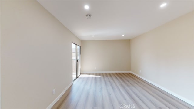 333 Burchett St Unit 203, Glendale, CA 91203 - empty room with light wood-style flooring, recessed lighting, and a smoke detector