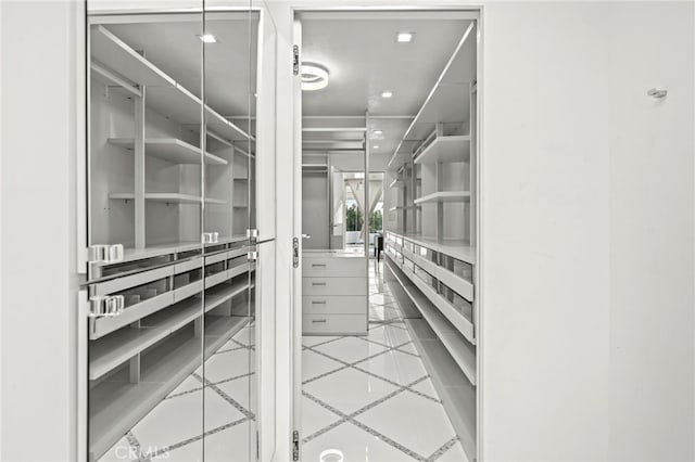1046 N Hillcrest Rd, Beverly Hills, CA 90210 - spacious closet featuring tile patterned floors