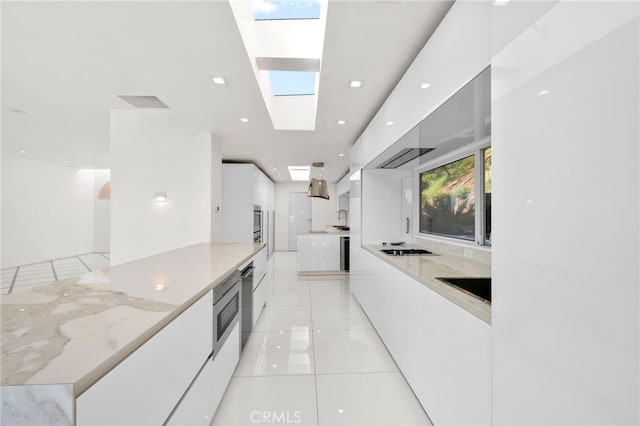 1046 N Hillcrest Rd, Beverly Hills, CA 90210 - kitchen featuring modern cabinets, white cabinetry, and light stone countertops