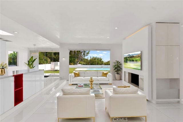1046 N Hillcrest Rd, Beverly Hills, CA 90210 - tiled living room with plenty of natural light and recessed lighting