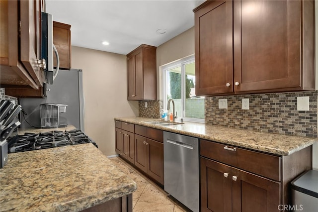10113 Hemlock St, Rancho Cucamonga, CA 91730 - kitchen with appliances with stainless steel finishes, a sink, tasteful backsplash, light stone countertops, and recessed lighting