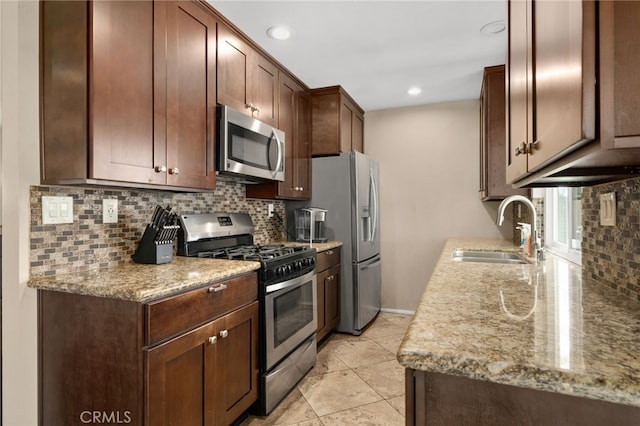 10113 Hemlock St, Rancho Cucamonga, CA 91730 - kitchen featuring stainless steel appliances, a sink, tasteful backsplash, recessed lighting, and light stone counters