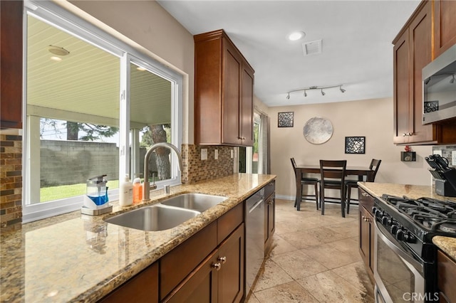 10113 Hemlock St, Rancho Cucamonga, CA 91730 - kitchen featuring a sink, stainless steel appliances, tasteful backsplash, and plenty of natural light