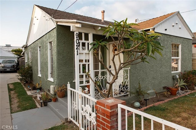 9021 Hegel St, Bellflower, CA 90706 - view of home's exterior featuring stucco siding and a shingled roof